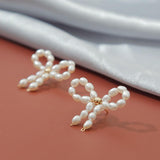 White Pearls Bow Tie Stud Earrings